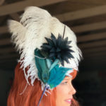 navy feathers Derby hat